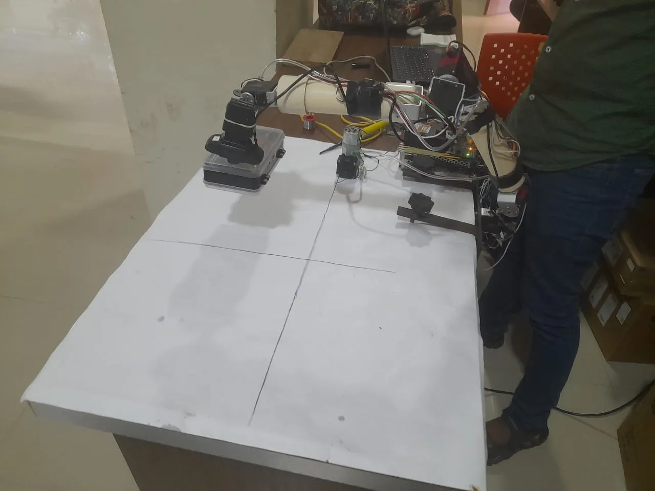 Full workbench with the arm, electronics, and sorting grid